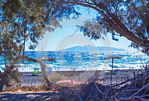 Wild empty morning beach Kamari Avis beach Santorini Greece