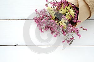 Wild flower bouquet on vintage white wood background