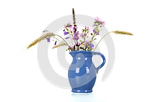 Wild flowers in blue vases