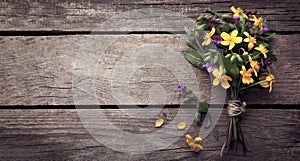 Wild flowers on old grunge wooden background