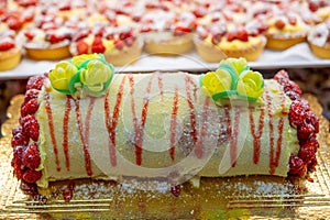 Wild fragolino strawberry and raspberry cakes in ancient city of strawberry Nemi, Castelli Romani, Italy close up