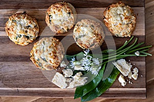 Wild garlic and cheese scones arranged on a wooden board