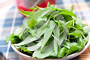 Wild garlic, ramsons on wooden table