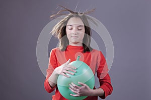 Wild hair from a balloon blast.