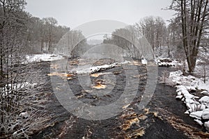 Wild Morrum river in snowy winter