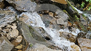 Wild Mountain River Flowing with Stone Boulders and Stone Rapids. Slow Motion