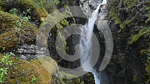 Wild mountain river water splashing in summer day