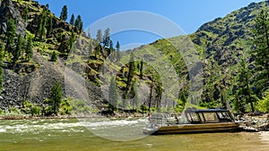 Wild Salmon River in Idaho with a Jet boat parked photo