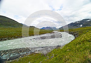 A wild, turbulent mountain river in the Sarek National Park, Sweden.