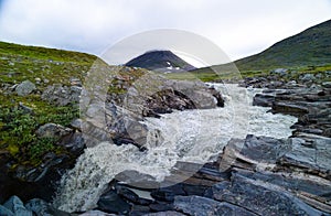 A wild, turbulent mountain river in the Sarek National Park, Sweden.