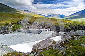 A wild, turbulent mountain river in the Sarek National Park, Sweden.