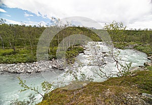 A wild, turbulent mountain river in the Sarek National Park, Sweden.