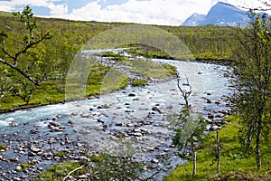 A wild, turbulent mountain river in the Sarek National Park, Sweden.