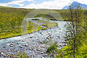 A wild, turbulent mountain river in the Sarek National Park, Sweden.