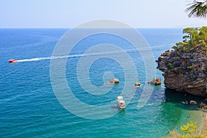 Wild Turkish beach in the Bay of the mountain coast of the Mediterranean Sea. August 7, 2022 Beldibi , Turkey