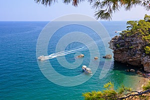 Wild Turkish beach in the Bay of the mountain coast of the Mediterranean Sea. August 7, 2022 Beldibi , Turkey