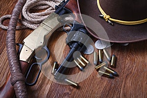 Wild west guns, ammunition and silver dollars
