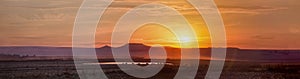 Wild west panorama sunnset with mountains photo