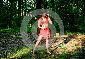 Wild woman in forest. Sexy girl early stage in the evolutionary development. Culture of wild human. Fashion primitive