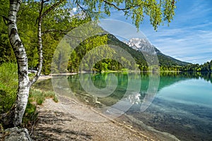 Wilder Kaiser mountain range reflected in idyllic Hintersteiner See, Scheffau, Tyrol, Austria, Europe