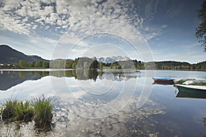 Wilder Kaiser mountain range reflected in a mountain lake