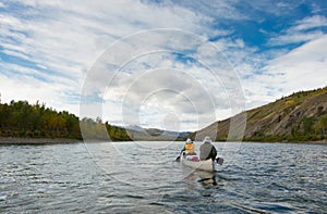 Wilderness adventure canoeists paddle Pelly River