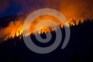 Wildfire with dark blue sky behind