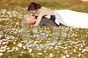 Wildflowers with bride and groom as silhouettes