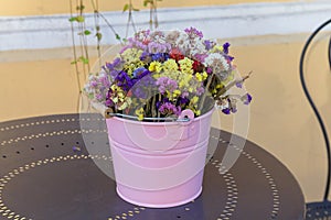 Wildflowers in a colorful bucket