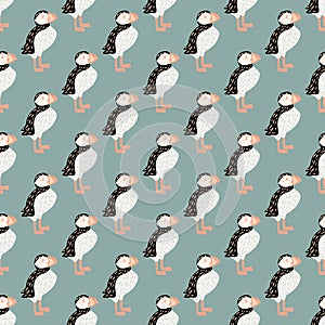 Wildlife animal athlantic seamless pattern with puffin bird silhouettes. Blue pastel background. Simple artwork