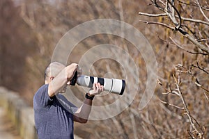 Wildlife and nature photographer in the forest