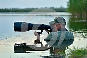 Wildlife photographer outdoor in action