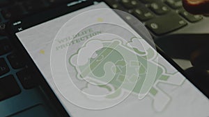 Wildlife protection inscription on smartphone screen. Recycle sign on a green friendly plastic cup image on grey