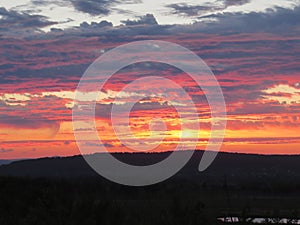 Wildly beautiful yellow-red sunset. Shooting in the nature.