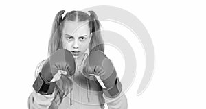 she will fight. concentrated kid punching. fist to fight. teen girl in boxing gloves. angry attack.
