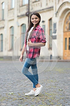 We will make you best. Fashion look of little child. Happy girl give thumbs up outdoors. Wearing casual style. Trendy