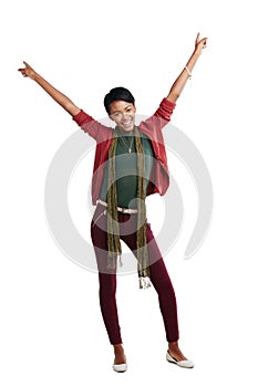 The will to win. Studio portrait of a young woman celebrating a win against a white background.