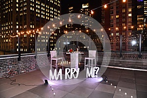 Will you marry me proposal decoration set with sign in the city.