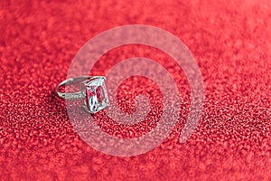 Will you marry me. Wedding ring on red glitter background. Engagement marriage proposal wedding concept. St. Valentine's