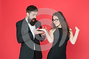 Will you marry me. woman make bearded man proposal. formal couple. ring in box. valentines day. sexy couple in love