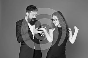 Will you marry me. woman make bearded man proposal. formal couple. ring in box. valentines day. sexy couple in love