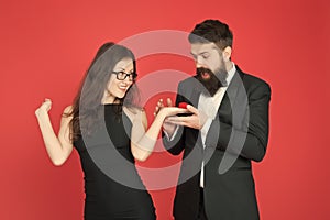 Will you marry me. woman make bearded man proposal. formal couple. ring in box. valentines day. sexy couple in love
