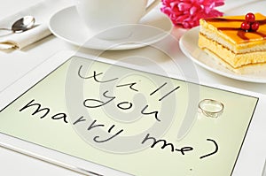 Will you marry me? written in a tablet computer
