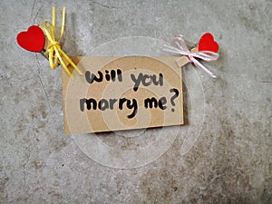 Will You Marry Me written on the wall