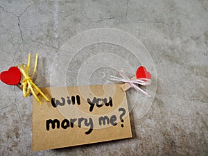 Will You Marry Me written on the wall