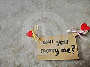 Will You Marry Me written on the wall