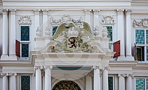 Willem IV crown and coat of arms on portico, Rotterdam, Netherlands