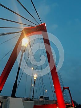 Willems bridge red night sky blue light lantern lamppost Rotterdam Netherlands sunset