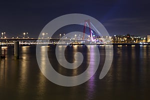 Willemsbrug Bridge and river Meuse at night