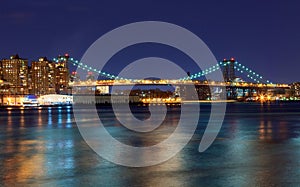 Williamsburg bridge by night, spanning the East River between Brooklyn and Manhattan